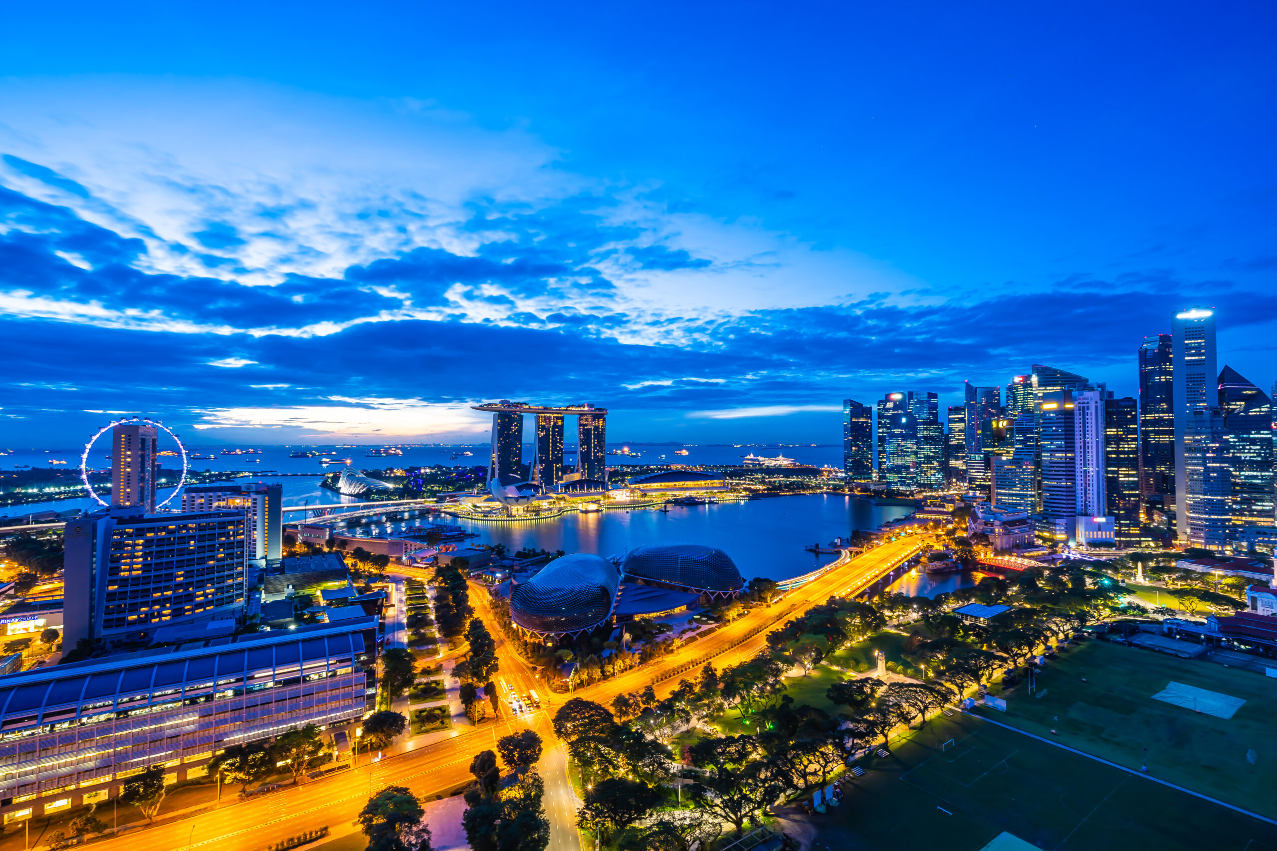 Beautiful architecture building exterior of singapore city skyline at twilight and night time