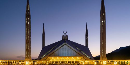 a beautiful shot of the Shah Faisal Masjid Mosque in Islamabad, Pakistan at sunset