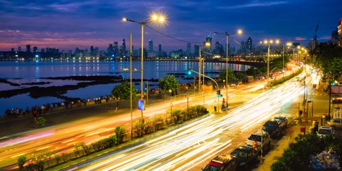 Mumbai famous iconic tourist attraction Queen's Necklace Marine drive in the night with car light trails. Mumbai, Maharashtra, India