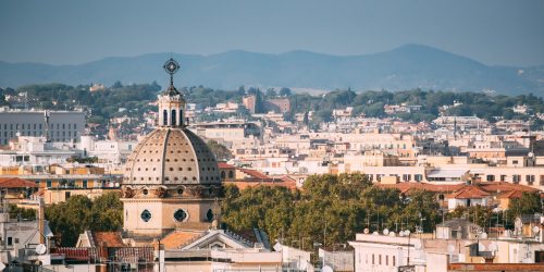 Rome, Italy. Cupola Of San Gioacchino Ai Prati Castello Church And Cityscape Of Town.