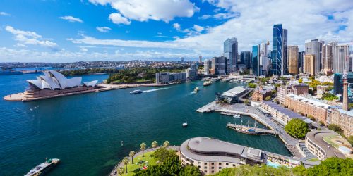 SYDNEY, AUSTRALIA - MARCH 4 2023: The Sydney CBD and surrounding harbour, including Circular Quay and The Rocks on a clear autumn day in Sydney, Australia